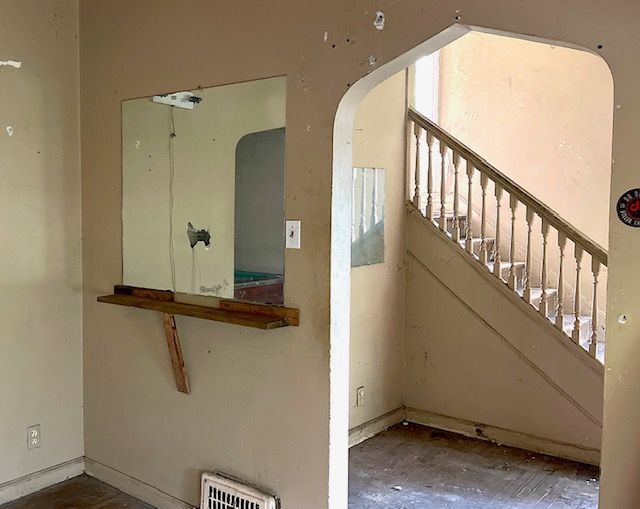 3872 Fischer St, Detroit, MI 48214 - stairs featuring arched walkways