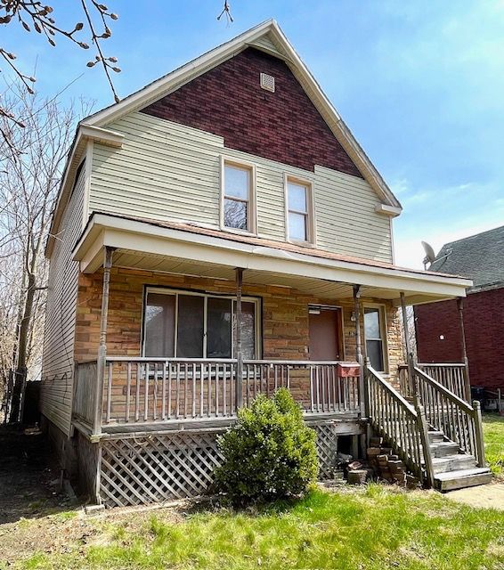 3872 Fischer St, Detroit, MI 48214 - view of front facade with covered porch and stone siding