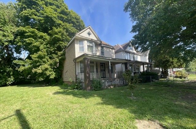 exterior space featuring a yard and a porch