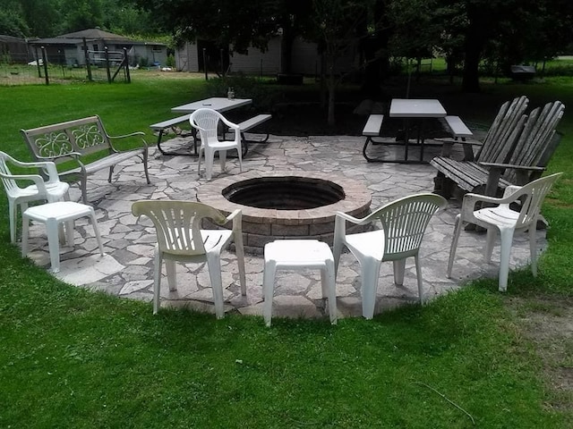 view of patio / terrace featuring an outdoor fire pit