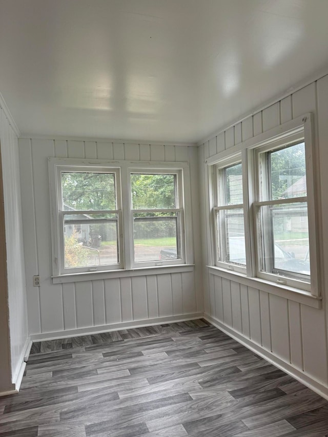 unfurnished sunroom featuring a wealth of natural light