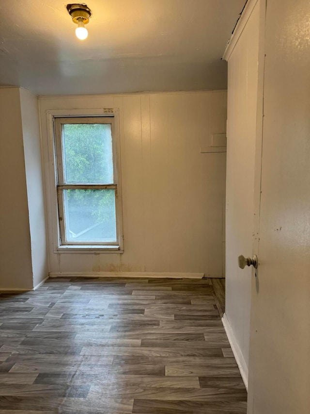 spare room with dark hardwood / wood-style flooring