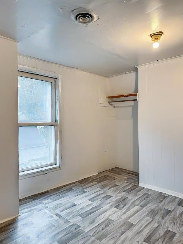 unfurnished room featuring light wood-type flooring