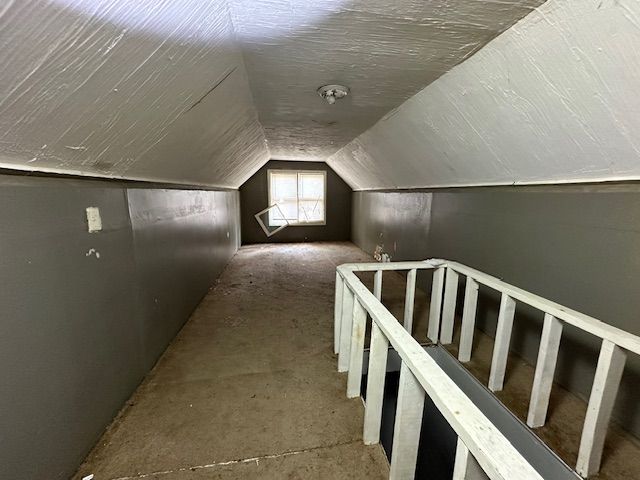 bonus room featuring lofted ceiling