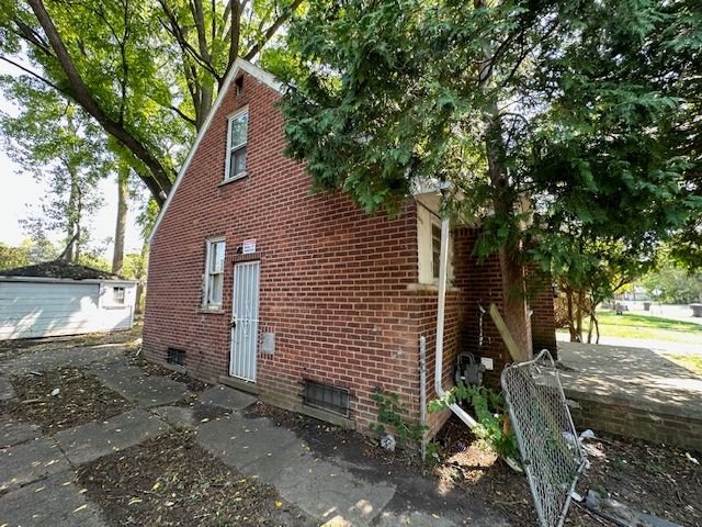 18538 Trinity St, Detroit, MI 48219 - view of side of property featuring brick siding