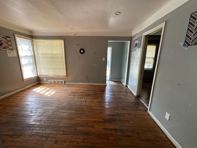 18538 Trinity St, Detroit, MI 48219 - unfurnished room with dark wood-type flooring and baseboards