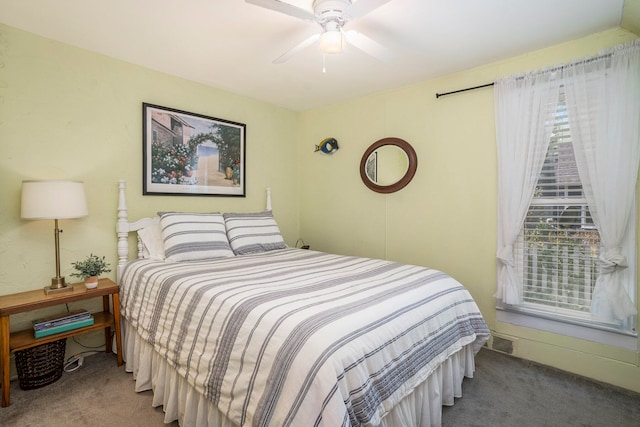 bedroom with ceiling fan and carpet floors