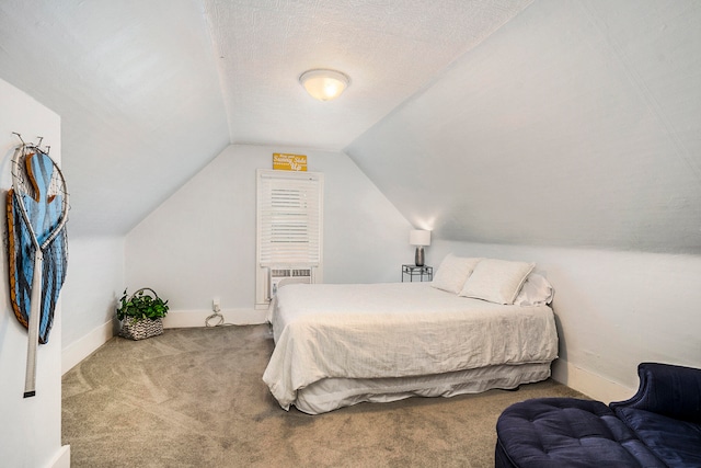 bedroom featuring cooling unit, carpet floors, a textured ceiling, and vaulted ceiling