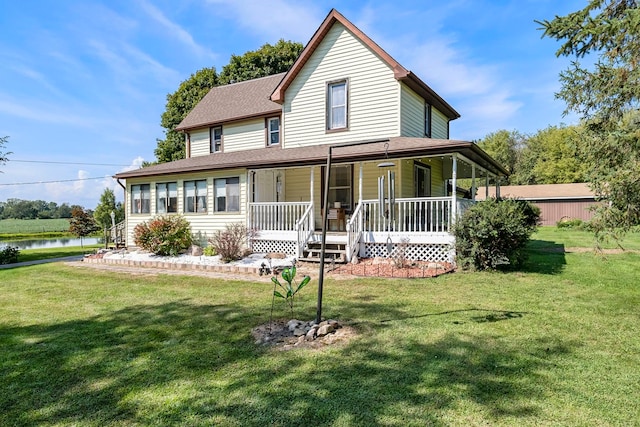 view of front of home with a water view, covered porch, and a front yard