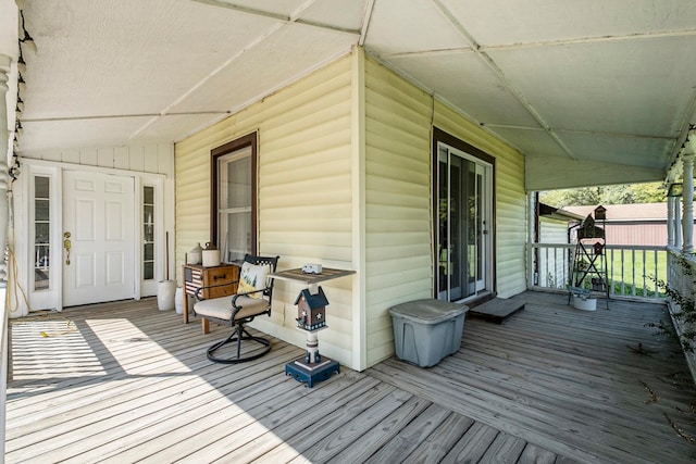 wooden terrace with a porch