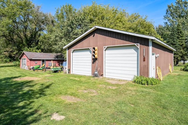 garage featuring a yard