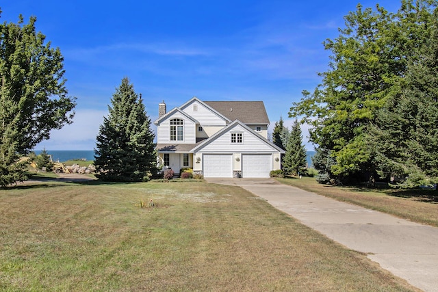 view of front of home featuring a front yard and a water view