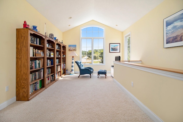 sitting room with carpet and lofted ceiling