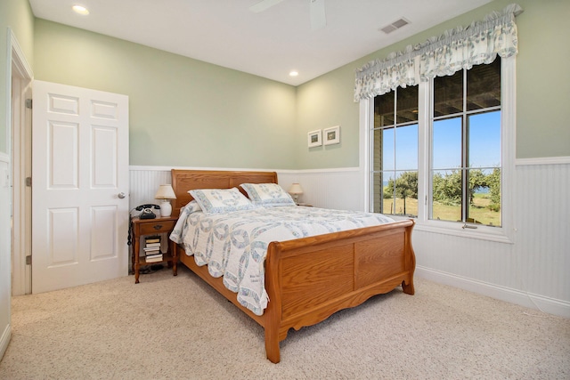 carpeted bedroom with ceiling fan