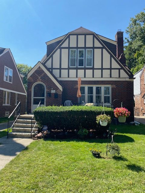 tudor house with a front yard