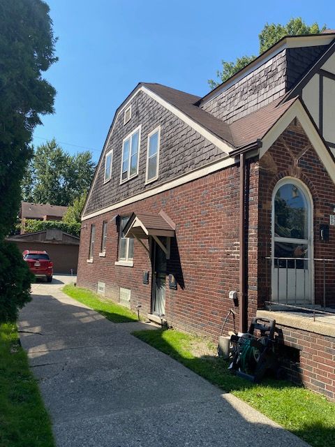 5051 Bishop St, Detroit, MI 48224 - view of home's exterior with brick siding
