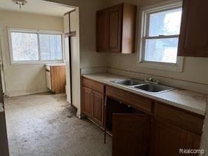 kitchen featuring plenty of natural light and sink