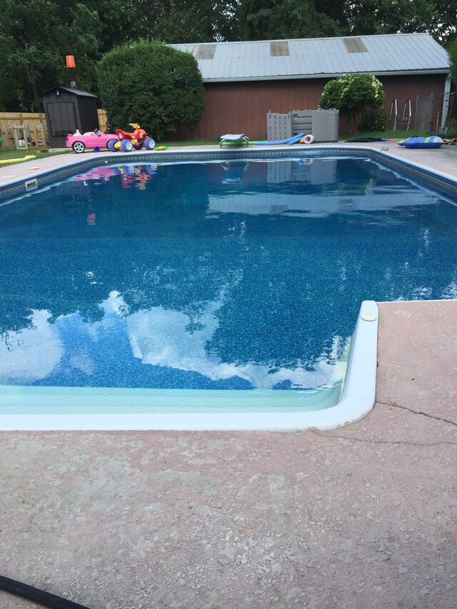 2065 S Lapeer Rd, Lapeer, MI 48446 - swimming pool featuring a diving board