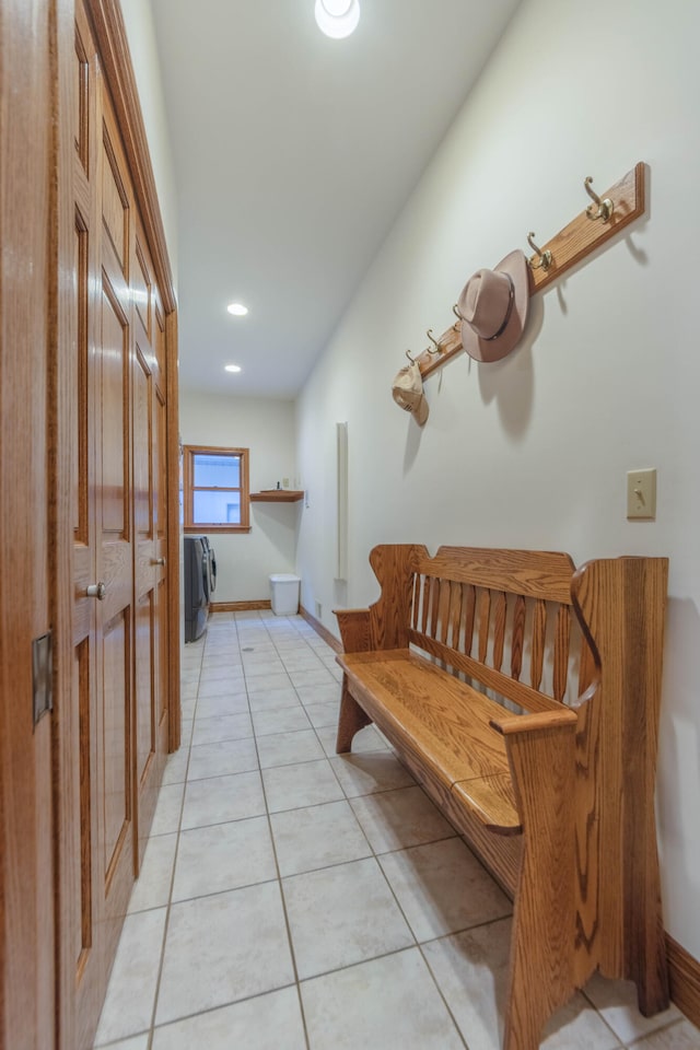 hall with light tile patterned floors