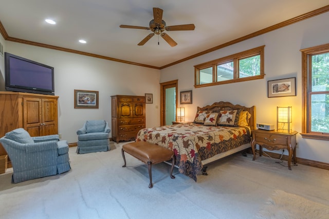 carpeted bedroom with ceiling fan and crown molding