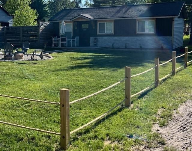 view of yard featuring a patio and an outdoor fire pit