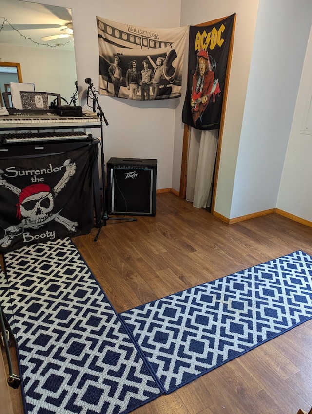 playroom featuring hardwood / wood-style flooring and ceiling fan