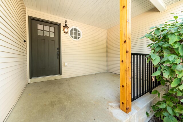 717 Tioga Park Unit 717, Big Rapids, MI 49307 - property entrance with a porch