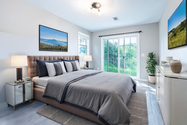 bedroom with light hardwood / wood-style floors