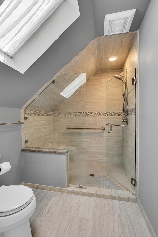 1620 Little Dr, Horton, MI 49246 - bathroom featuring toilet, a shower stall, and lofted ceiling