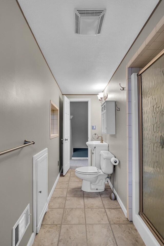 1620 Little Dr, Horton, MI 49246 - bathroom with toilet, a shower stall, baseboards, and a sink