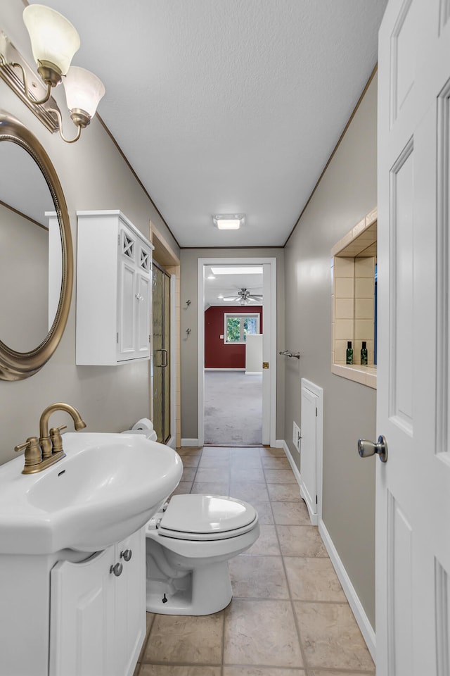 full bathroom with toilet, a shower with door, a textured ceiling, baseboards, and ceiling fan