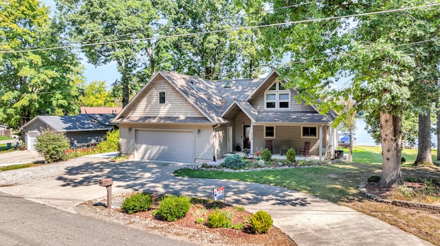 view of front of house with a front yard, a garage, and driveway