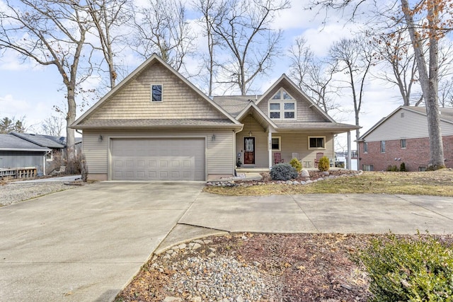 view of front of property featuring covered porch, driveway, and an attached garage