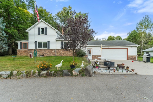 view of front of house featuring a garage and a front lawn