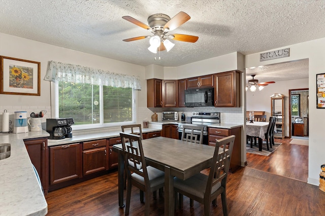 dining area with a textured ceiling, dark hardwood / wood-style flooring, and ceiling fan