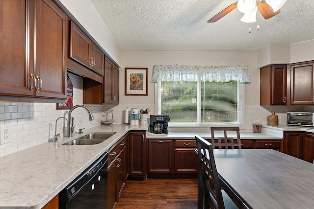 kitchen featuring a textured ceiling, sink, black dishwasher, and dark wood-type flooring