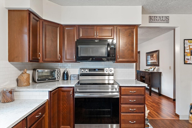 kitchen with backsplash, dark wood-type flooring, stainless steel electric stove, light stone countertops, and a textured ceiling