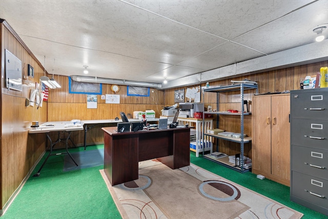 carpeted office space with wood walls