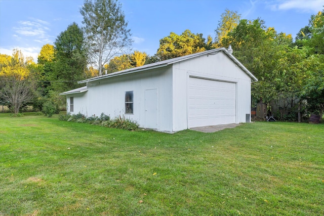 garage with a yard