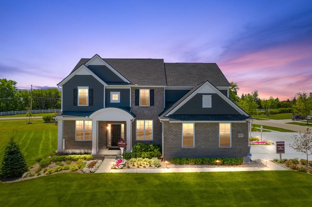 view of front of home with a lawn