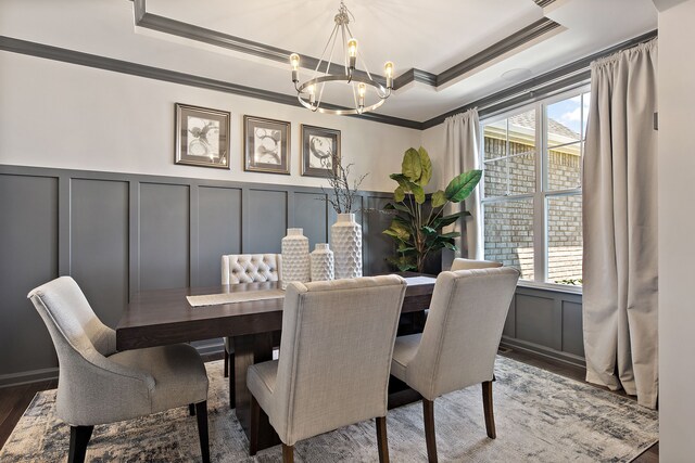 00 Hidden River Dr, Armada, MI 48005 - dining space featuring a decorative wall, ornamental molding, a raised ceiling, a chandelier, and wood finished floors