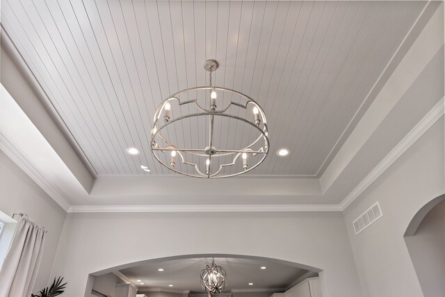 00 Hidden River Dr, Armada, MI 48005 - detailed view of a chandelier, a tray ceiling, arched walkways, ornamental molding, and recessed lighting