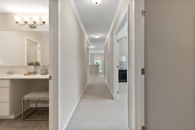 00 Hidden River Dr, Armada, MI 48005 - hallway with ornamental molding, baseboards, and a sink