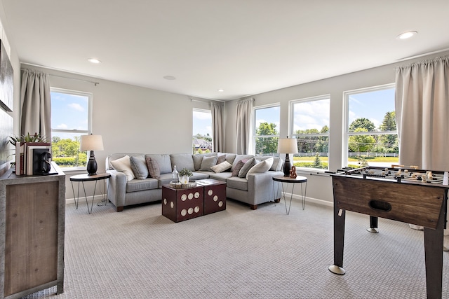 carpeted living room featuring a wealth of natural light