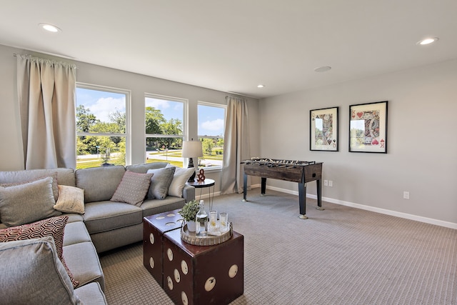 carpeted living room featuring plenty of natural light