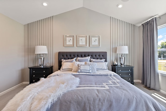 carpeted bedroom featuring lofted ceiling