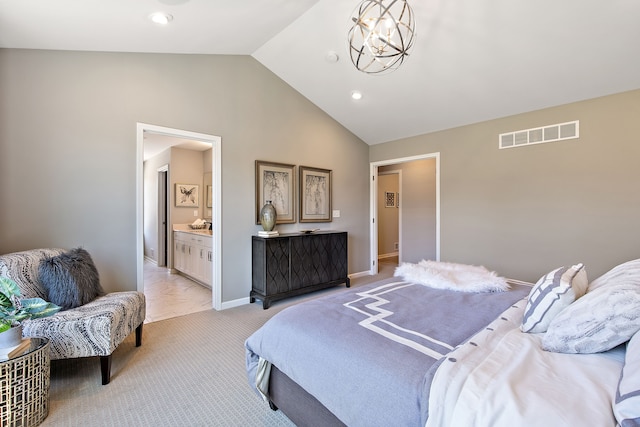 carpeted bedroom with vaulted ceiling, an inviting chandelier, and ensuite bath