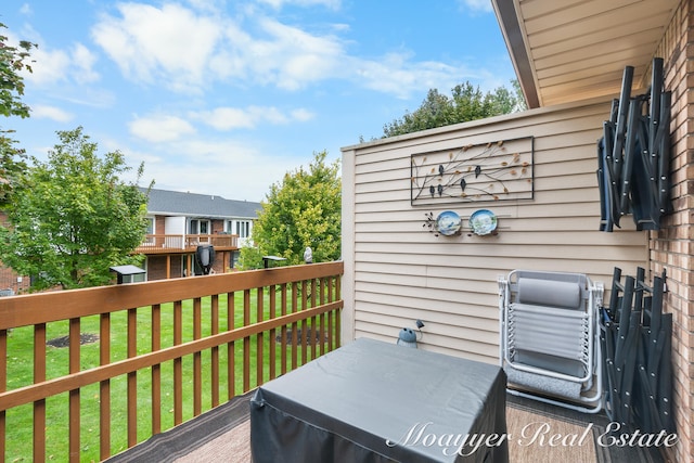 wooden deck with a yard