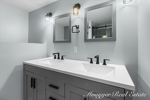 bathroom featuring double vanity and a sink