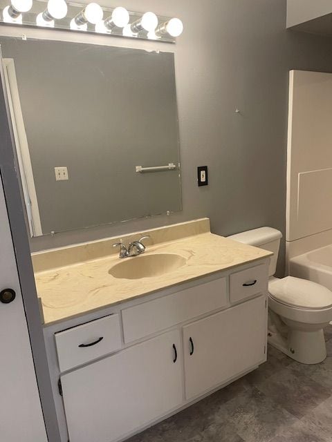 bathroom with vanity and toilet